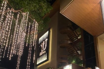 Yu Hotels glowing at dusk with a peaceful neighborhood ambiance